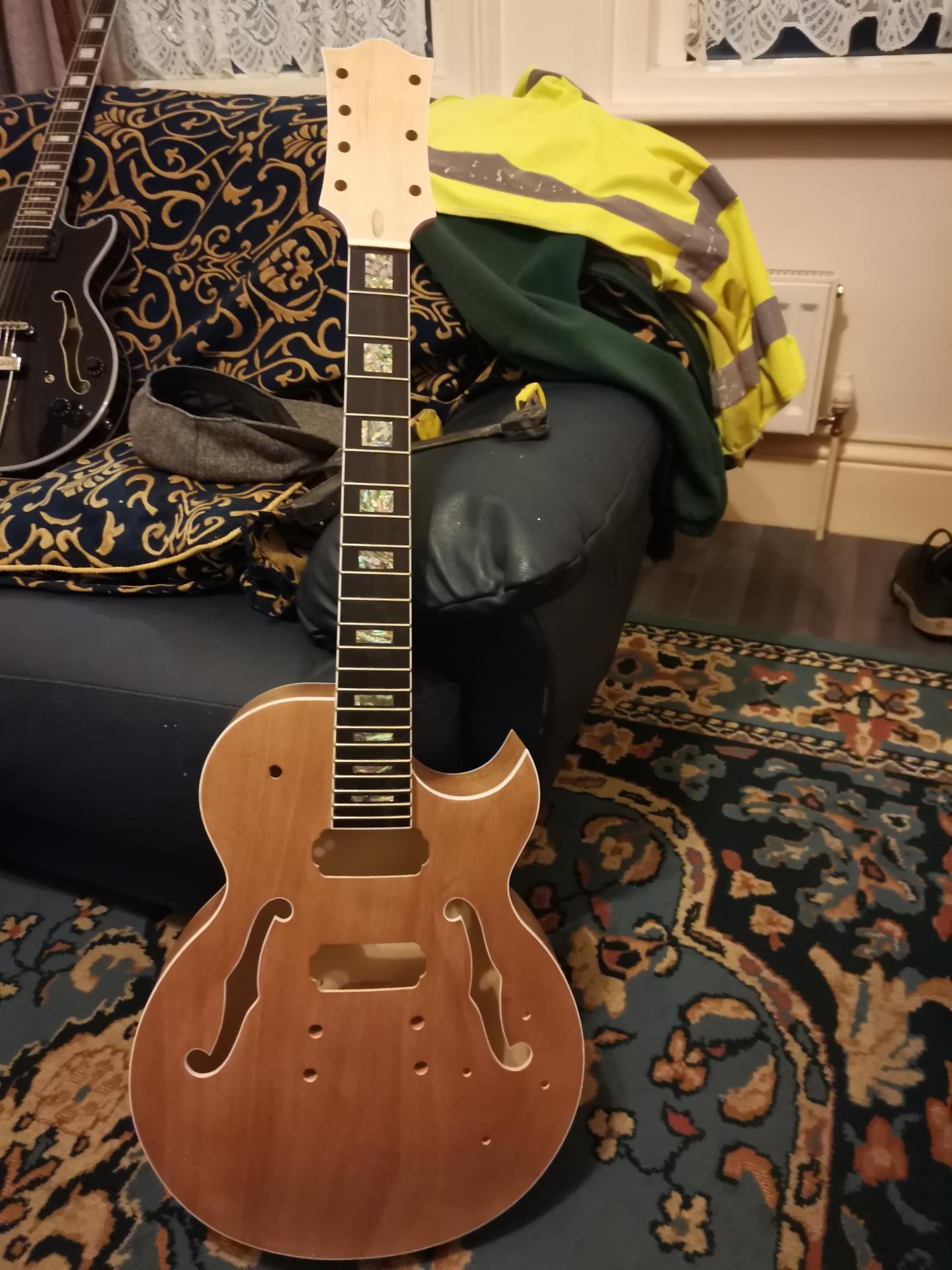 Finished E75 hollow body 7-string guitar kit built by customer Barry Singleton